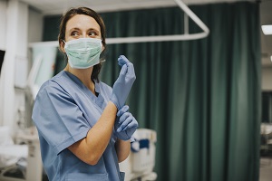 Nurse wearing facemask and gloves