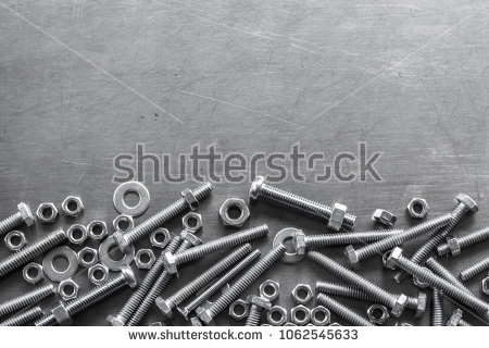 SS-Fasteners-screws-stainless-nuts-and-bolts-on-grunge-metal-background-top-view.jpg